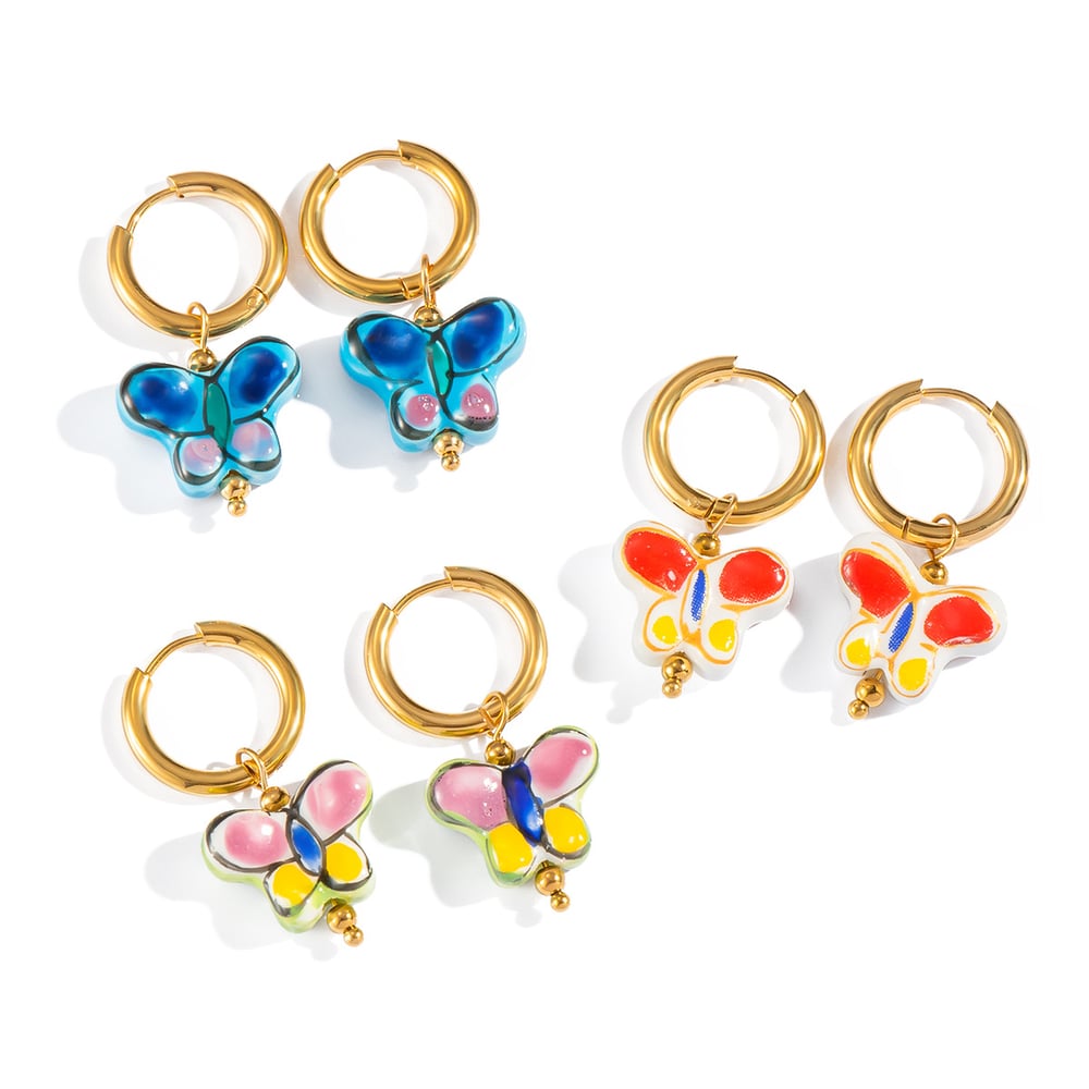 1 par de pendientes románticos de mariposa de acero inoxidable en color dorado. h5Imagen5