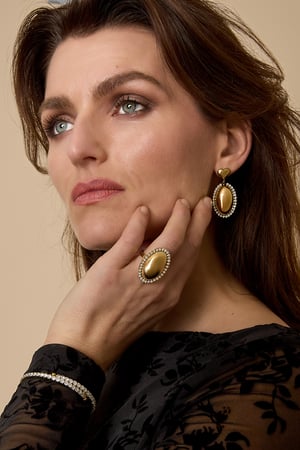 Statement earrings with an oval charm surrounded by stones h5 Picture3