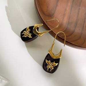 1 paio di orecchini pendenti in legno con nodo a fiocco h5 Immagine4