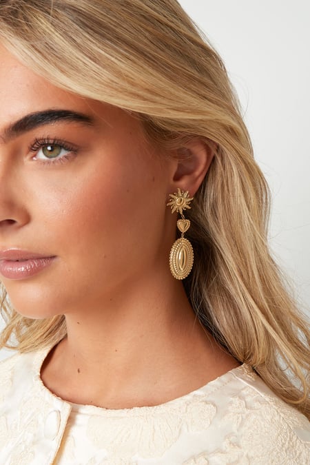 Love the sun dangle earrings