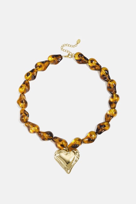 Beaded necklace with naturally shaped beads and a hanging heart 2