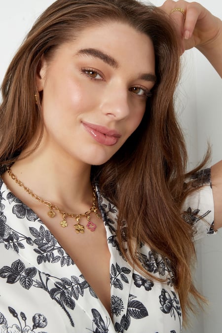 necklace with clover and flower charms