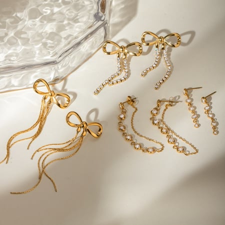 1 par de pendientes de acero inoxidable con circonitas y lazo para mujer, serie romántica
