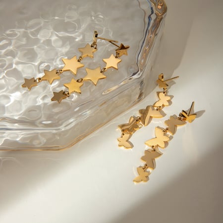 europäischer und amerikanischer grenzüberschreitender -stil, schlichter 18 karat gold-edelstahl, glatte ganze schnur, kleine schmetterlingsquasten-ohrringe, ohrschmuck für frauen 2