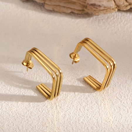 1 par de pendientes de botón de acero inoxidable de color dorado 2