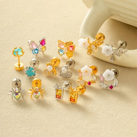 1 pieza de pendientes de mariposa con circonitas de color cobre y dorado. 2