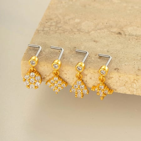 1 piercing para la nariz con circonita color cobre y dorado. 2