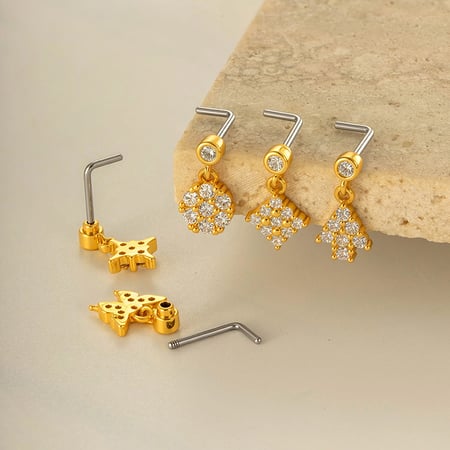 1 piercing para la nariz con circonita color cobre y dorado.
