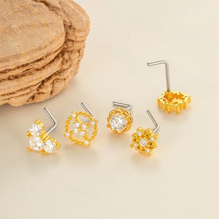 1 piercing para la nariz con circonita color cobre y dorado. 2