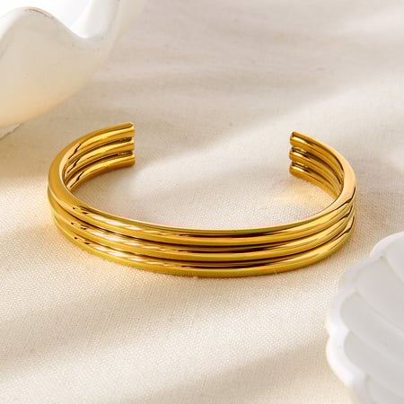 1 pulsera de puño de acero inoxidable con forma circular, sencilla e informal, color dorado para mujer. 2