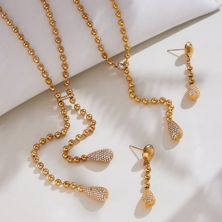 Luxe dames sieradenset met druppelvormige, roestvrijstalen, goudkleurige zirkonia's