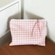 Large square bag with tied string. Pink grid
