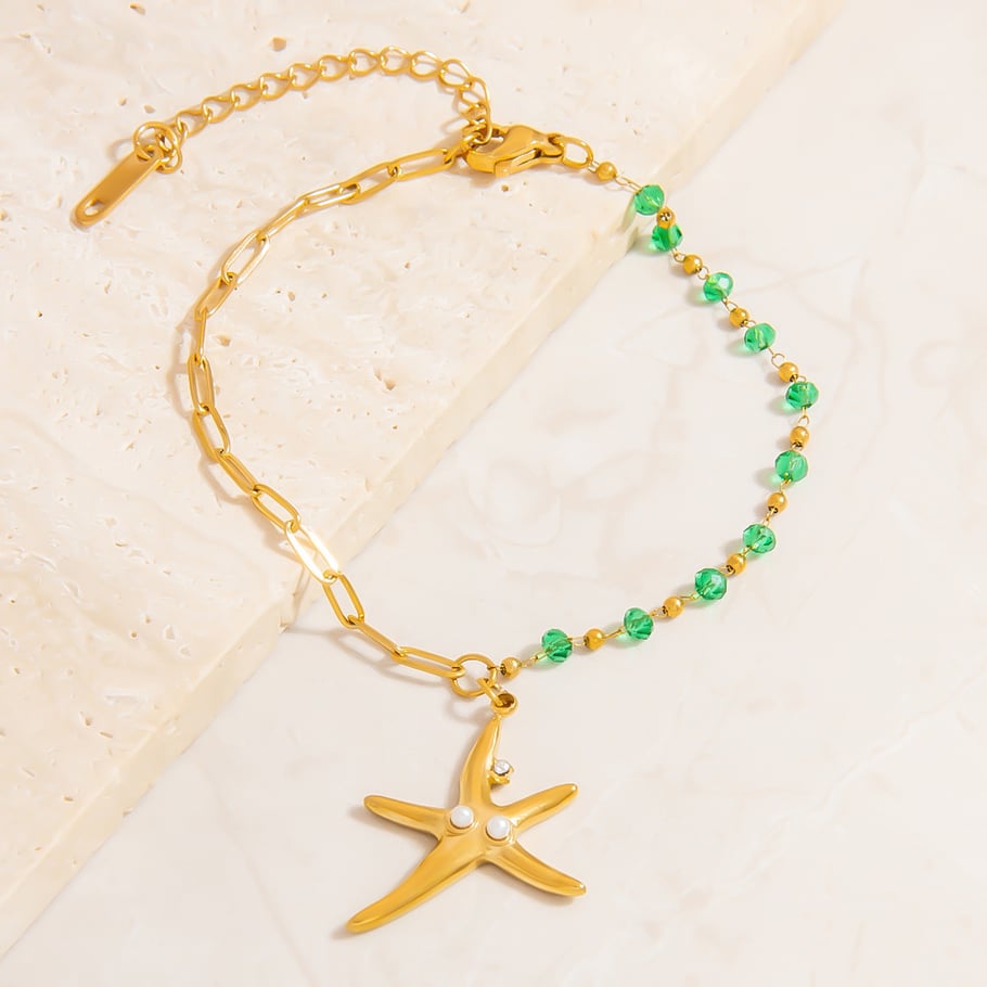 Pulseras con dijes de acero inoxidable color dorado oceánico Imagen5