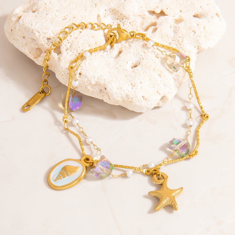 Pulseras con dijes de acero inoxidable color dorado oceánico Imagen4