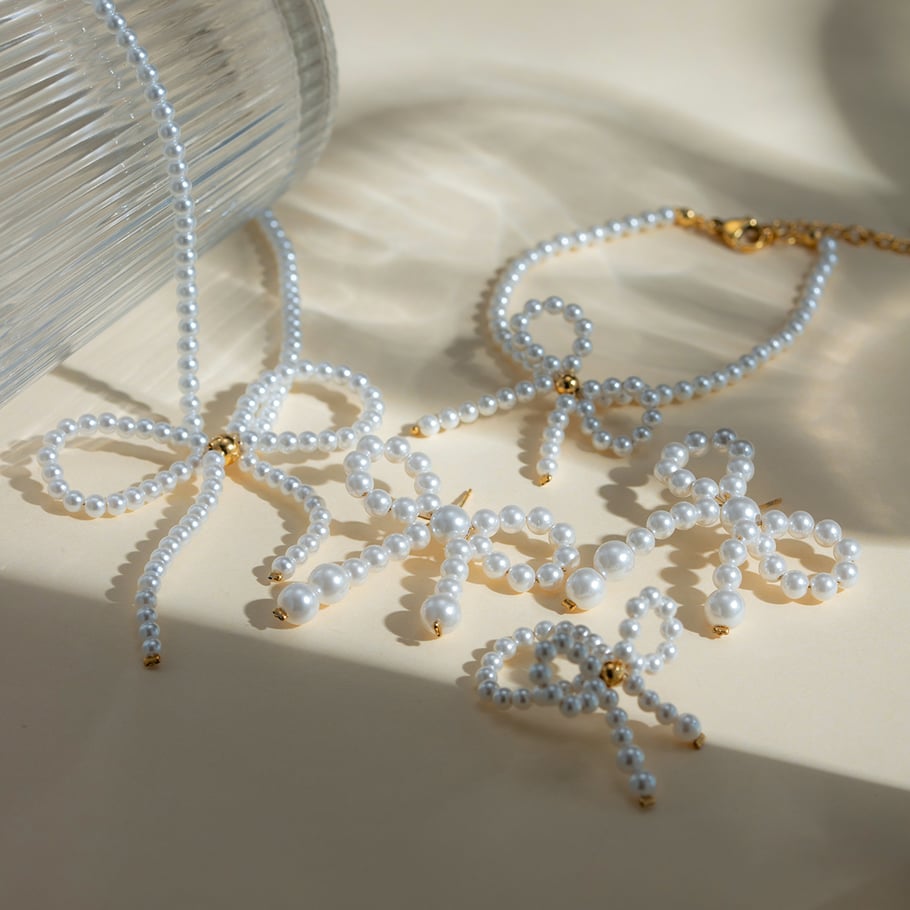 europäische und amerikanische grenzüberschreitende -stil mode licht luxus high-end 18 karat gold edelstahl bogen perle ohrringe ohrringe zubehör für frauen Bild4