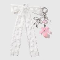 1 set of white bow keychain 