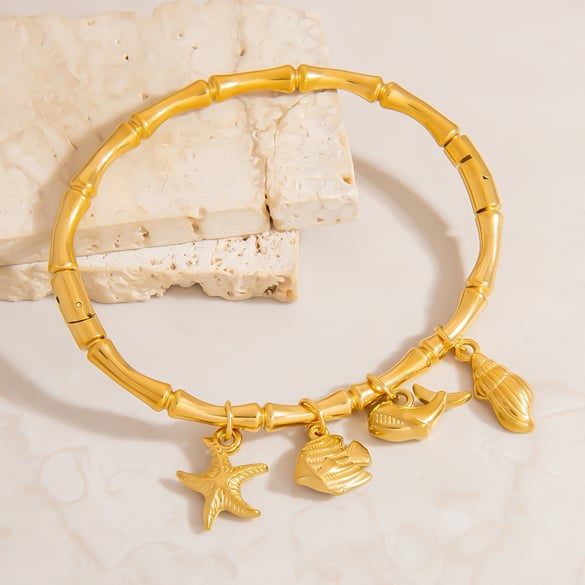 1 stuk stijlvolle damesarmbanden met zee-organisme, roestvrij staal en gouden bedel 2