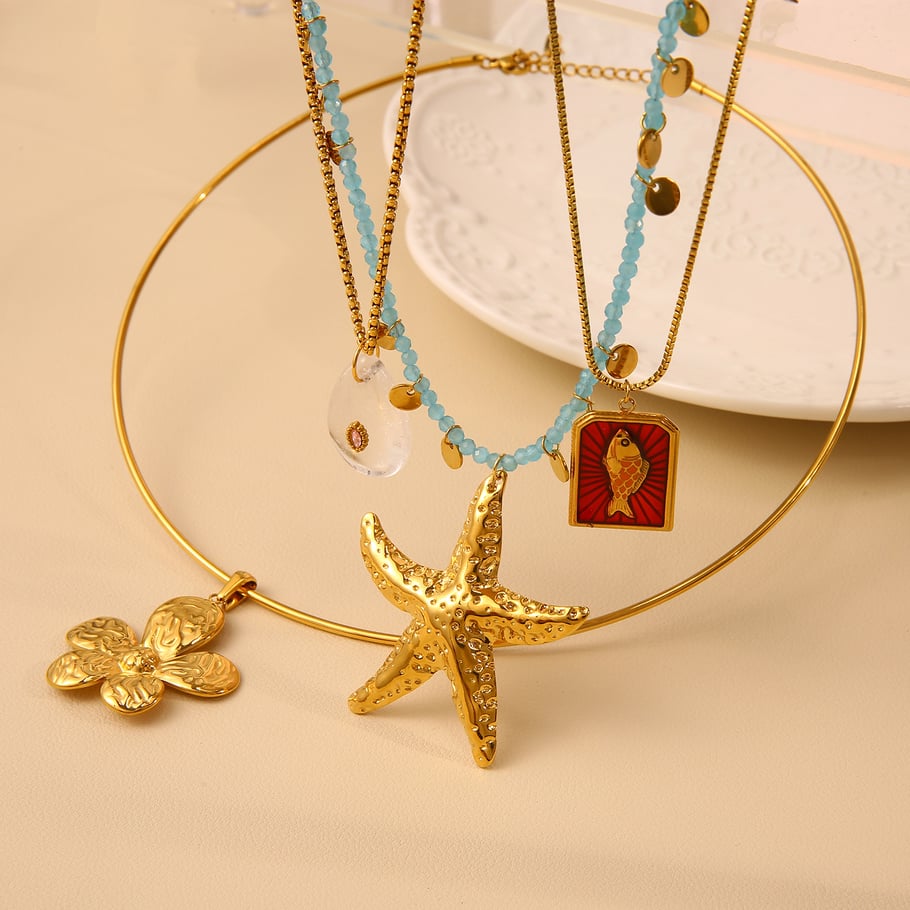 Collane con ciondolo a forma di stella marina oceanica in acciaio inossidabile color oro da donna Immagine3