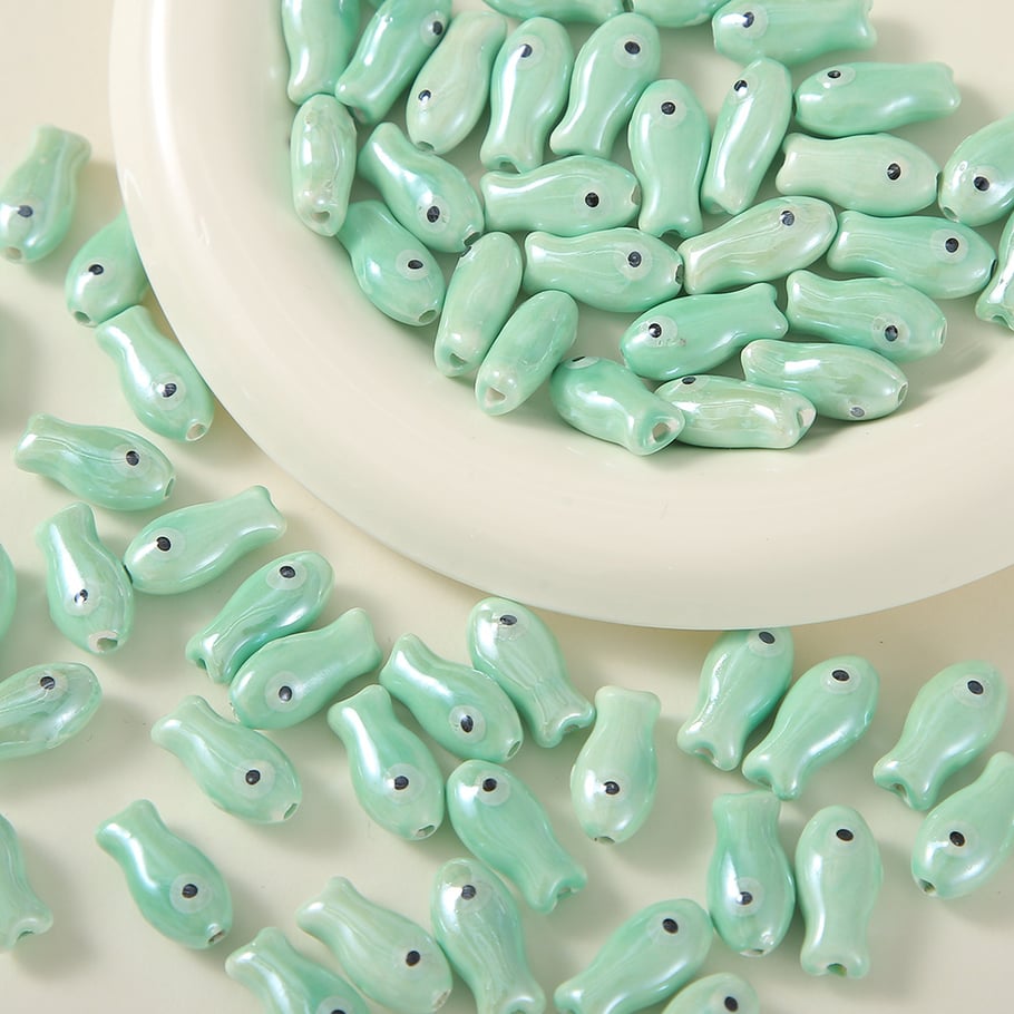 1 pezzo di perlina in ceramica a forma di pesce per gioielli fai da te 