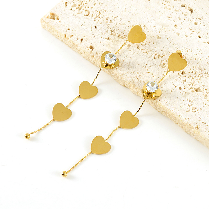 Orecchini pendenti con nappa in acciaio inossidabile color oro Immagine4