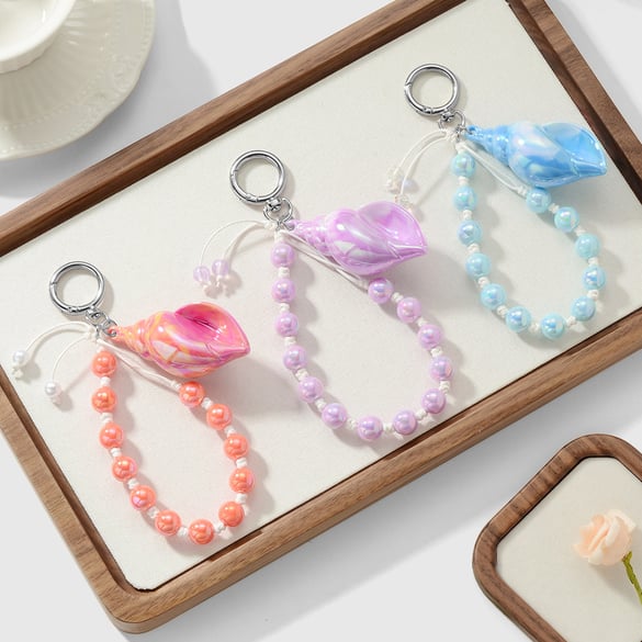 Ciondoli per borse a forma di buccino di Sweet Beads