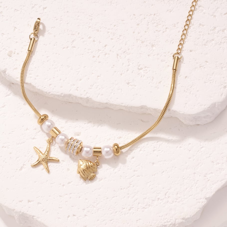 Braccialetti con ciondoli da donna in acciaio inossidabile color oro con pesci tropicali Immagine4