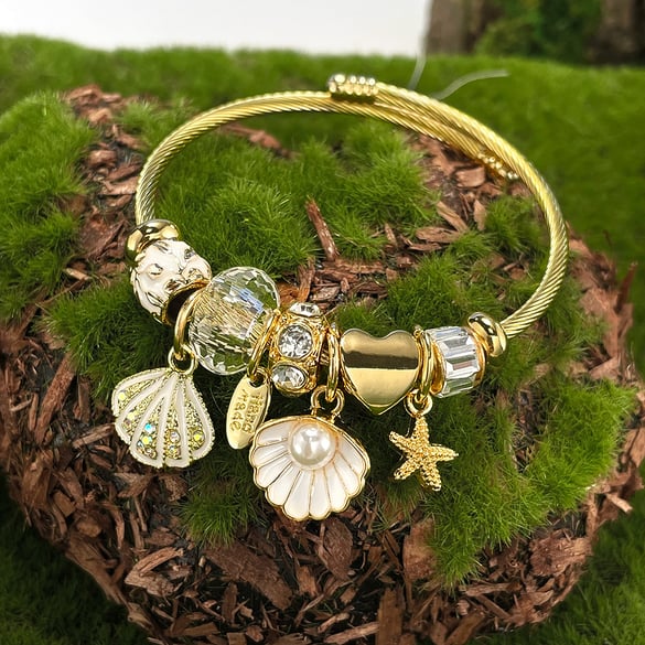 Ozeanische Goldfarbene Manschettenarmbänder