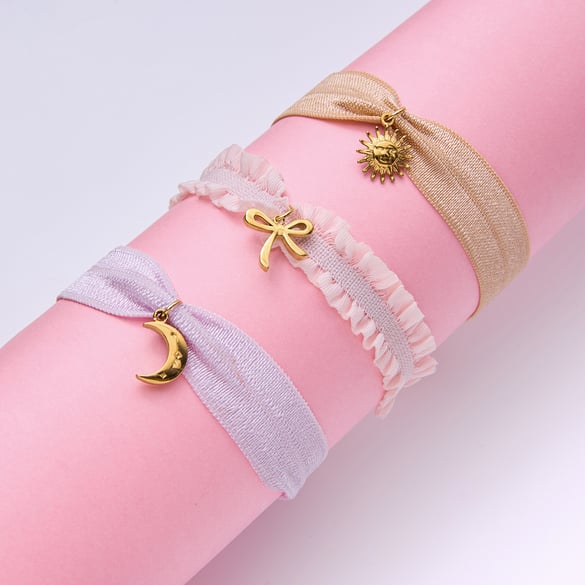 Bracelet à breloques pour femme en acier inoxydable couleur or avec nœud papillon