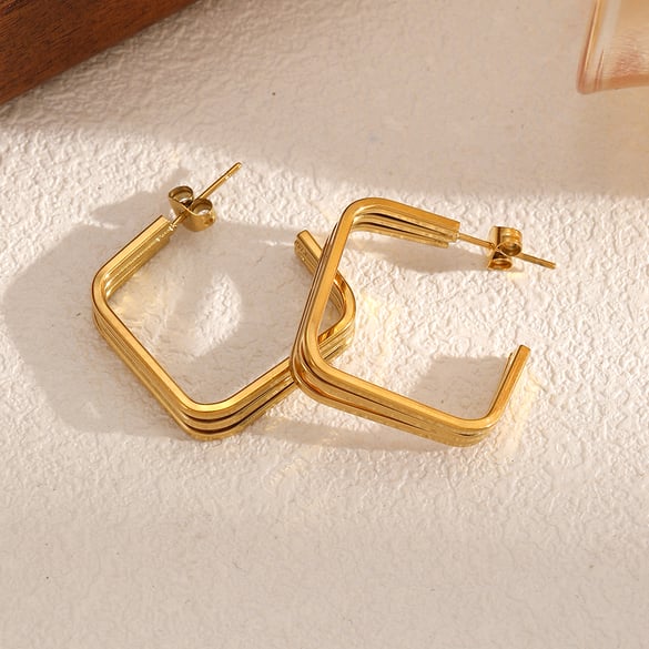 1 par de pendientes de botón de acero inoxidable de color dorado 2