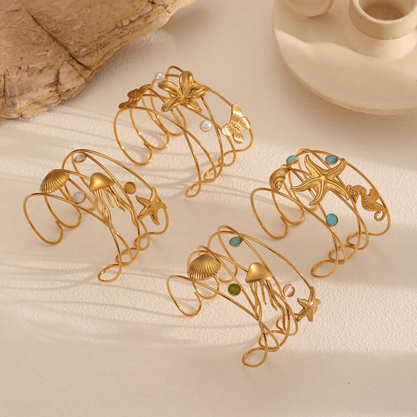 1 pulsera de acero inoxidable estilo oceánico en color dorado.