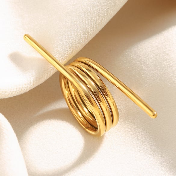 1 Stück Statement-Ringe aus Edelstahl in Federform mit täglicher Drehung und Goldfarbe