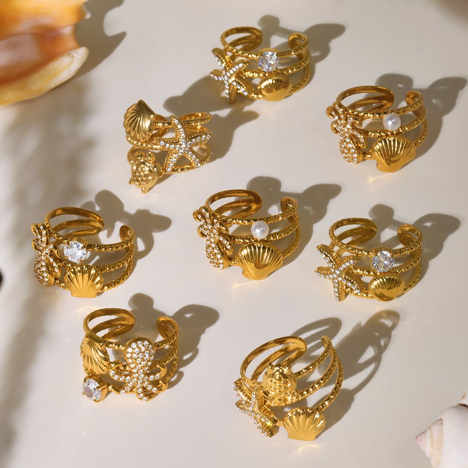 1 pezzo di anelli in acciaio inossidabile color oro con organismo marino scintillante Immagine3