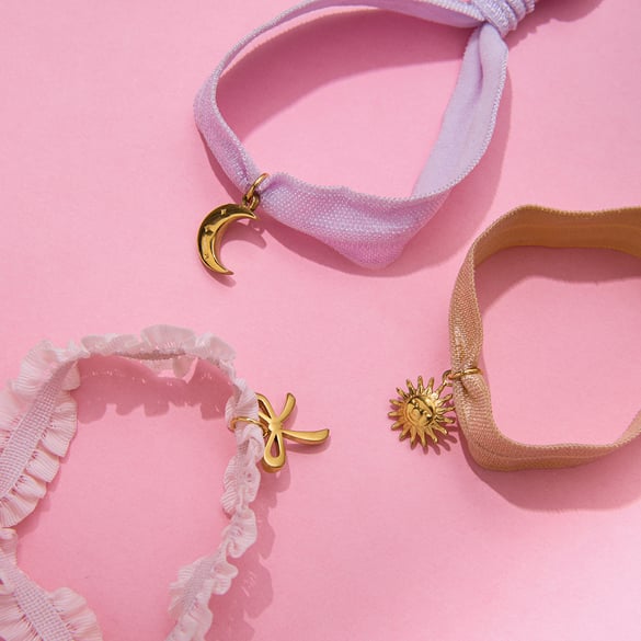 Bracelet à breloques pour femme en acier inoxydable couleur or avec nœud papillon 2