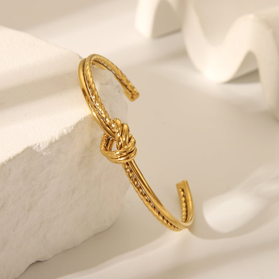 Pulsera de acero inoxidable color dorado con forma de giro de 1 pieza Imagen3