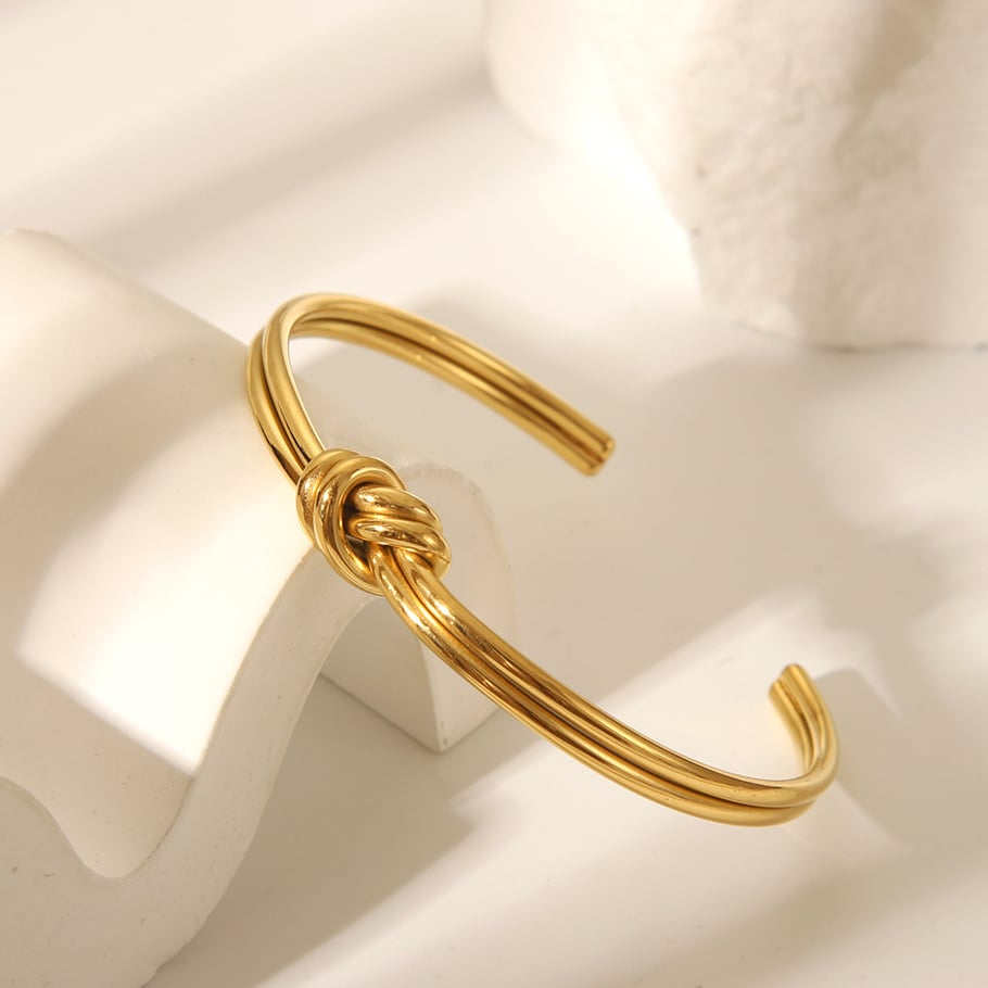 Pulsera de acero inoxidable color dorado con forma de giro de 1 pieza Imagen2