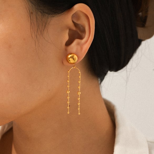 1 paar kwastjes oorbellen van roestvrij staal met gouden hangers