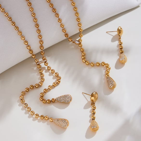 Lussuosi set di gioielli da donna in acciaio inossidabile con zirconi color oro e goccia